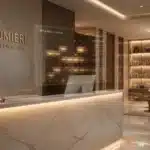 Reception area of a modern medical spa with marble desk, digital appointment display, and elegant decor.